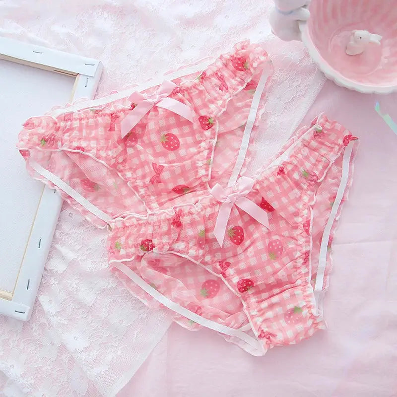 Pink strawberry-print mesh thong panties with gingham pattern, ruffles, and pink bows.