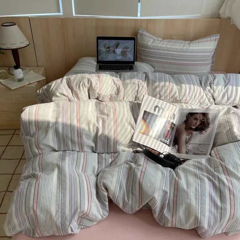 Cotton striped bedding set with duvet cover and pillowcases in pastel tones