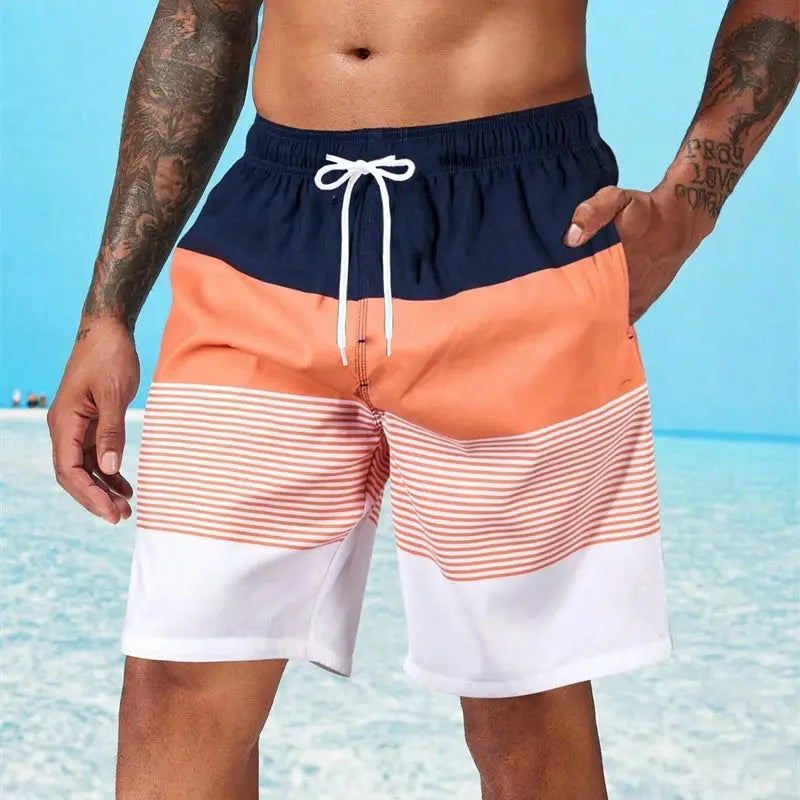 Men's beach board shorts with navy, peach stripe and white panels; white drawstring, quick-dry