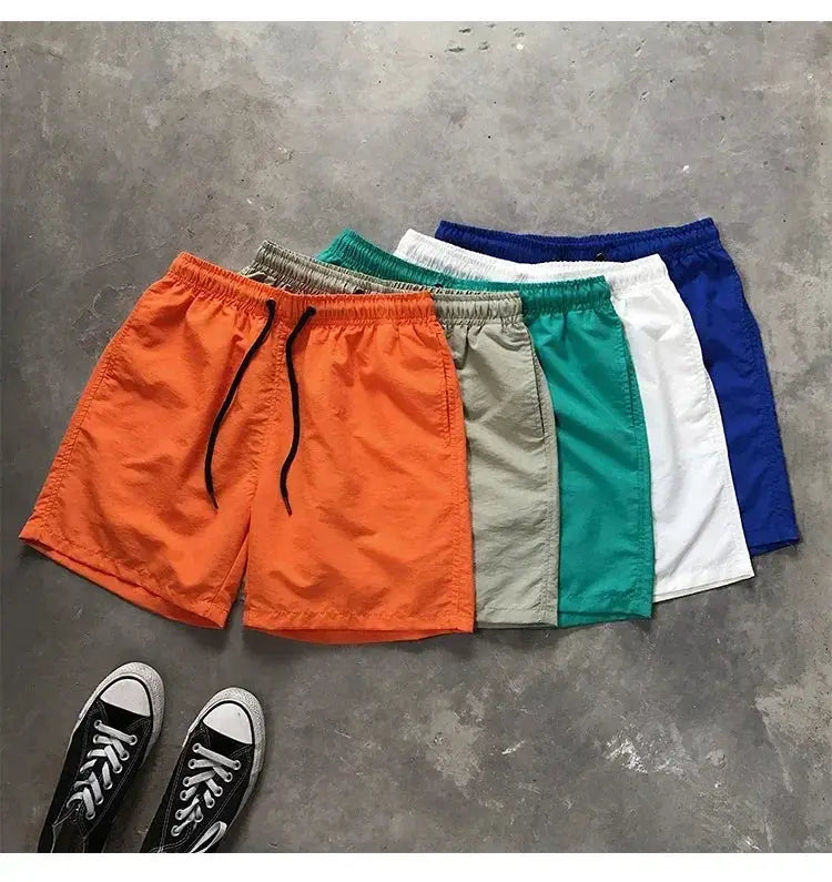 Men's swim shorts 7-pack in assorted colors (orange, gray, khaki, teal, white, blue)