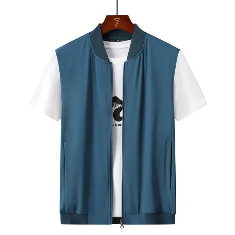 Men's ultrathin sleeveless vest in blue with zip front, layered over a white tee.