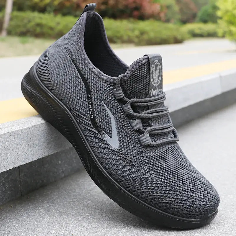 Men's knit running shoes in charcoal gray with Volta logo, breathable mesh upper, non-slip sole