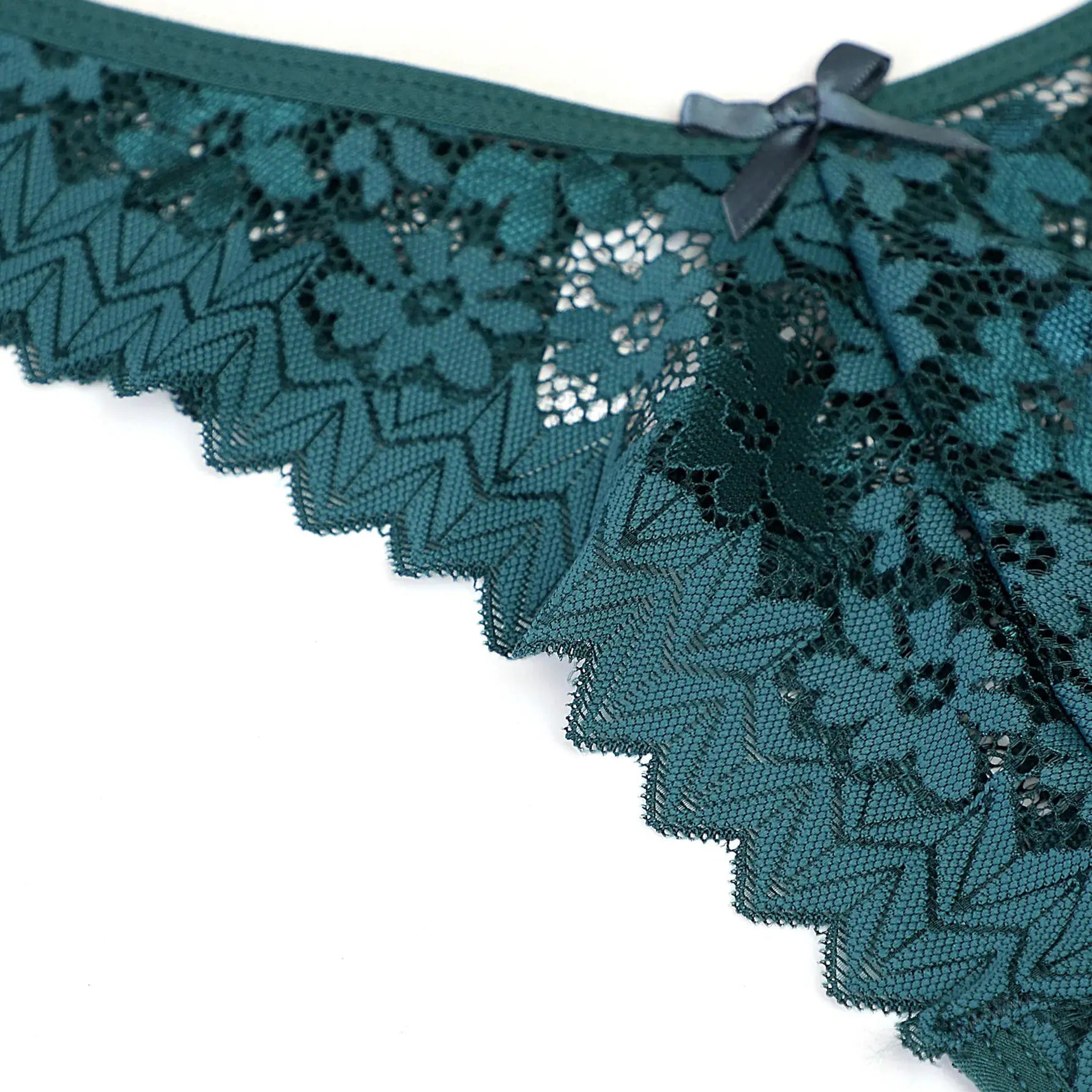 Simples Market Women's teal lace thong with low waist and bow accent.