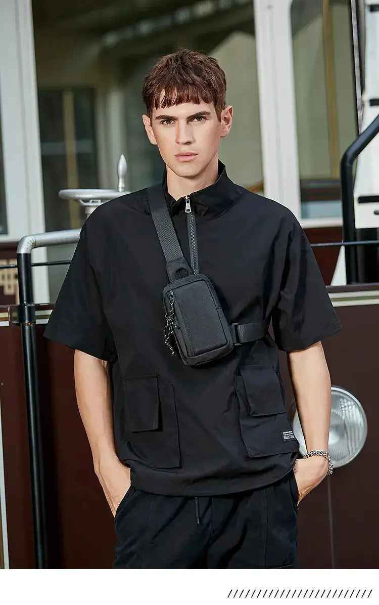 Crossbody bag by Simples Market, small black mini chest bag worn diagonally across the chest