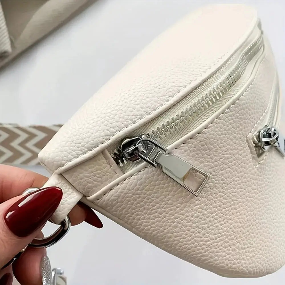 Soft leather saddle bag by Simples Market; cream pebbled finish, compact crossbody with silver zipper