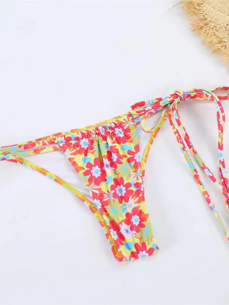 Floral string bikini bottom with side ties in a bright colorful print