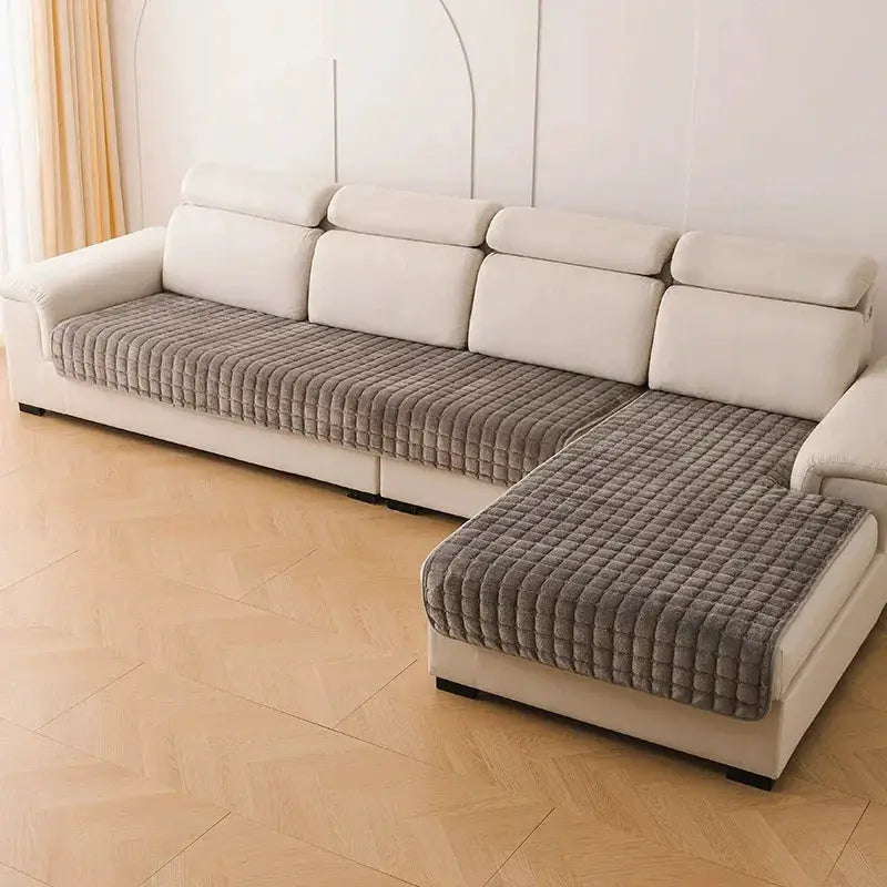 Flannel plaid sofa cover; universal non-slip, thickened quilted gray seat cushions on beige sectional.