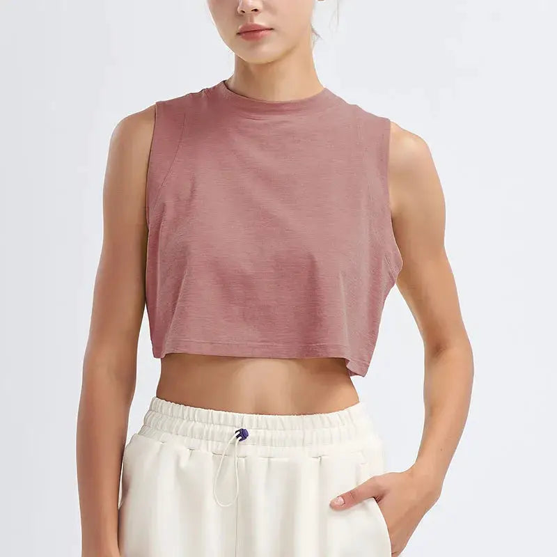 Women's pink cropped athletic top, sleeveless, loose fit, breathable quick-dry fabric