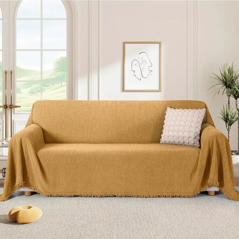 Couch cover in golden chenille with fringe and herringbone texture for sofa decor