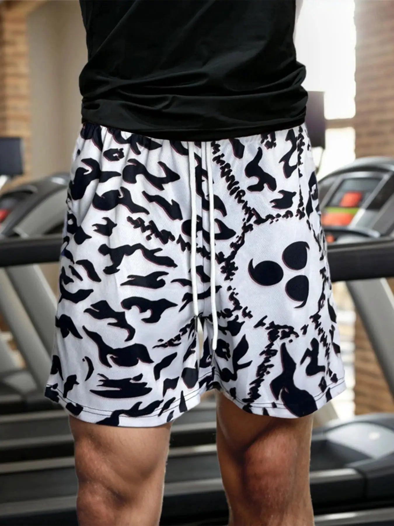 Men's gym shorts with white base and black abstract print, drawstring waistband