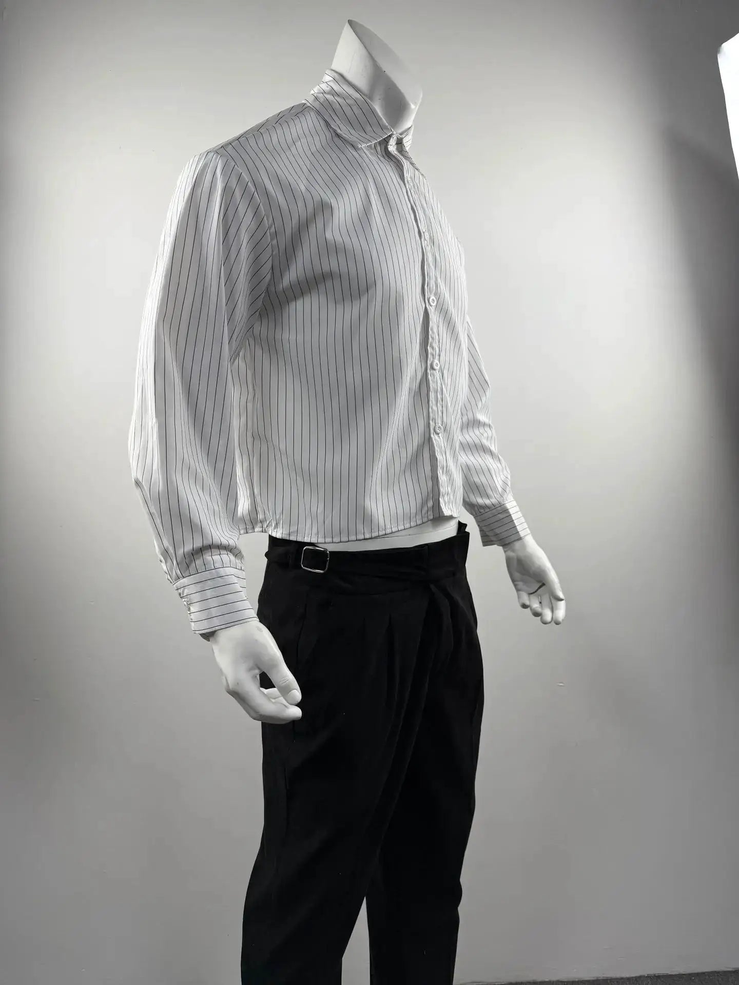 Men's striped white shirt with thin black vertical stripes, long sleeves, button front on mannequin.