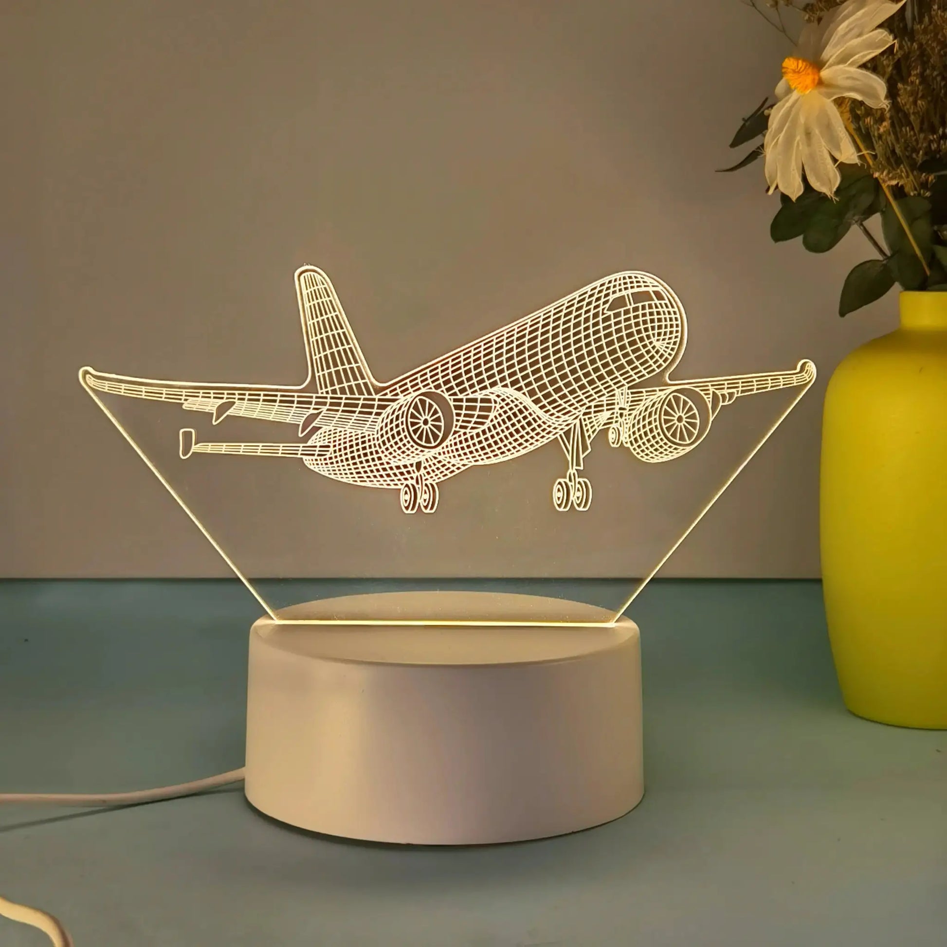 Aircraft model 3D night light by Simples Market; USB-powered wireframe airplane lamp on white base