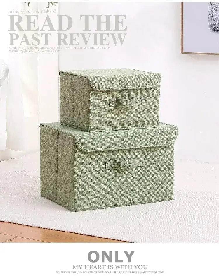Fabric storage boxes in green; two-piece foldable cotton-linen set with lids by Simples Market