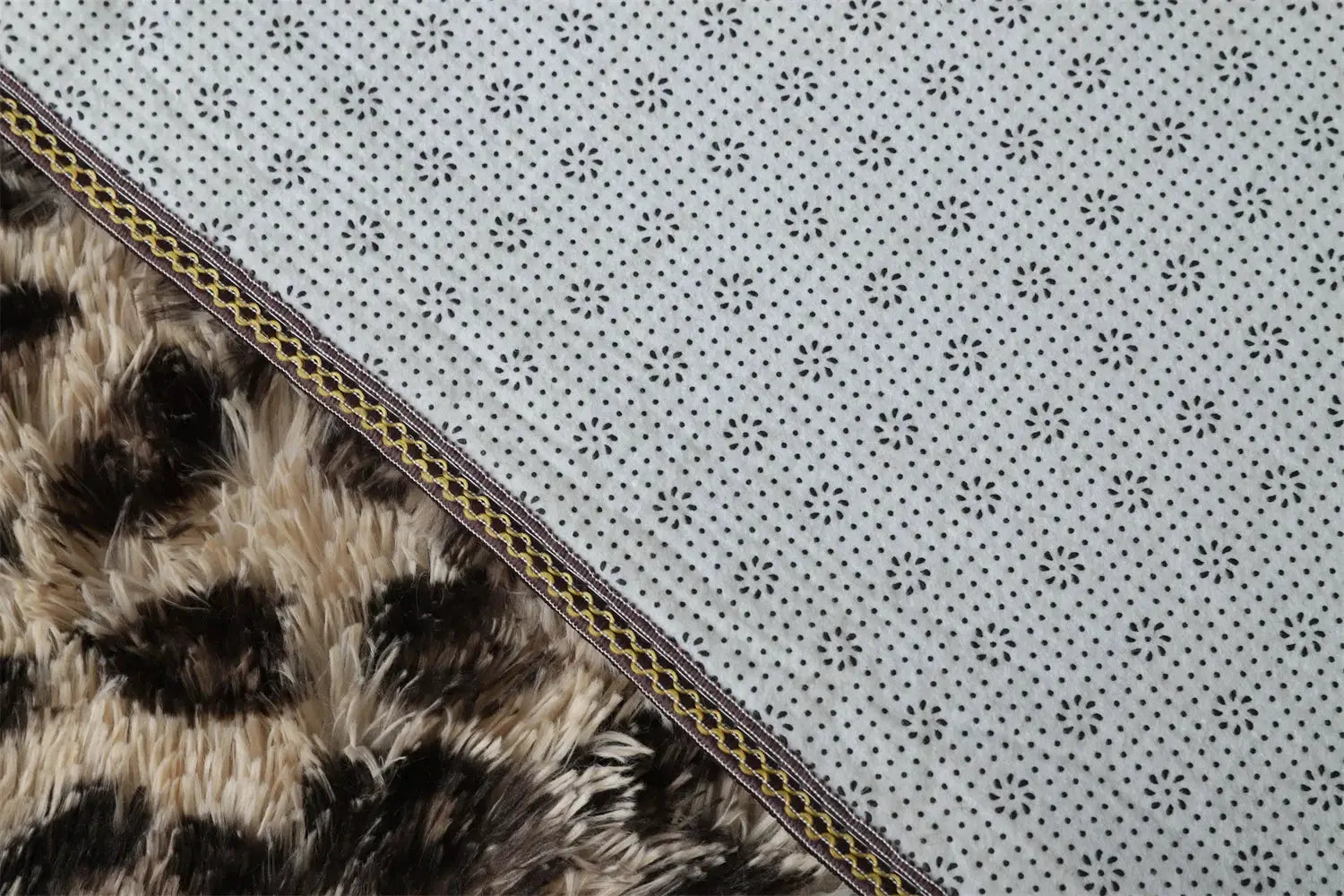 Premium fluffy area rug with gray dotted floral pattern beside brown faux fur shag rug