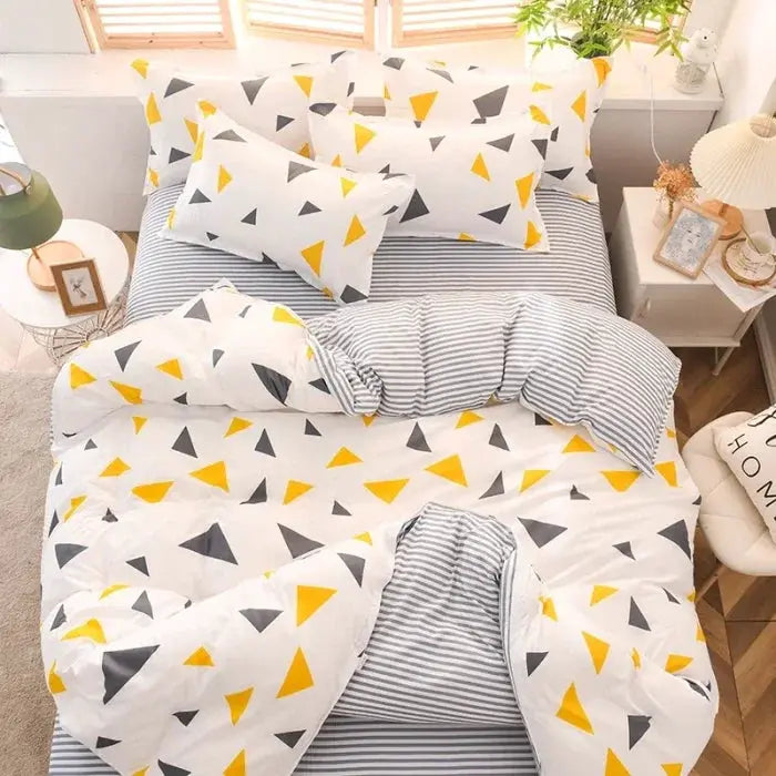 Simples Market four-piece cotton bedding set with white base and yellow and gray triangle pattern; striped reverse.