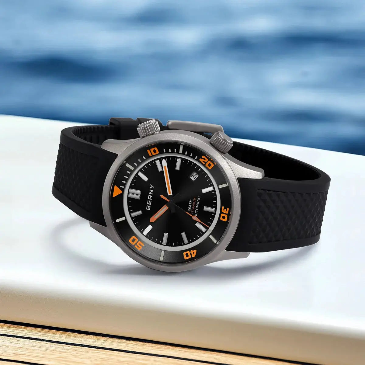 BERNY 20ATM titanium diver watch for men with black dial, orange bezel markings, date window, and black rubber strap