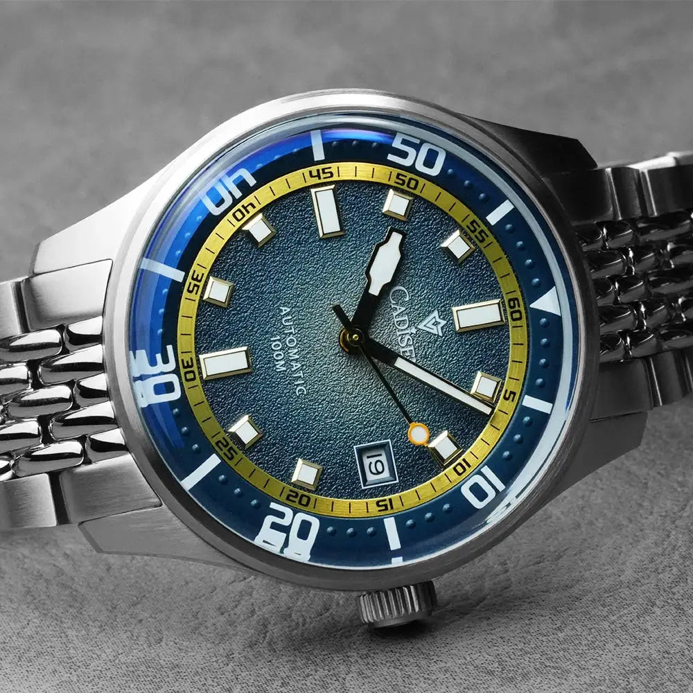 CADISEN automatic mechanical men's watch with blue dial, yellow inner ring, and stainless steel bracelet