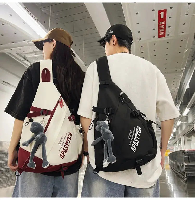 Two New Y2k nylon crossbody backpacks, white/red and black colorways with plush grey keychains.