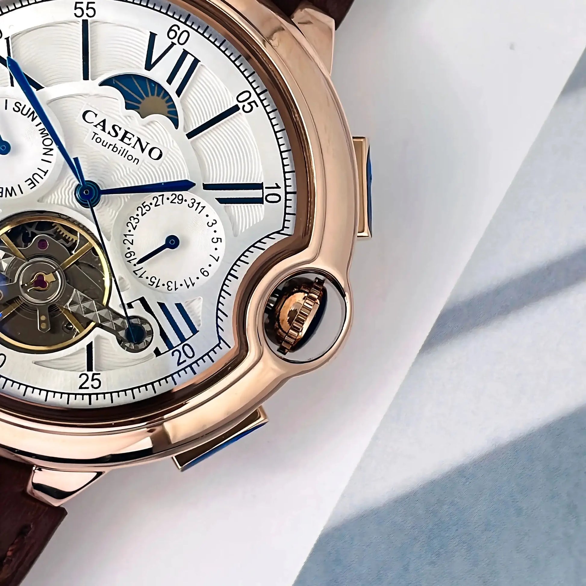 CASENO Star Roman Grand men's tourbillon automatic watch with white dial, blue hands, gold case, brown leather strap