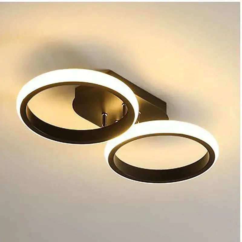 LED ceiling light with dual circular rings, modern design and warm white glow