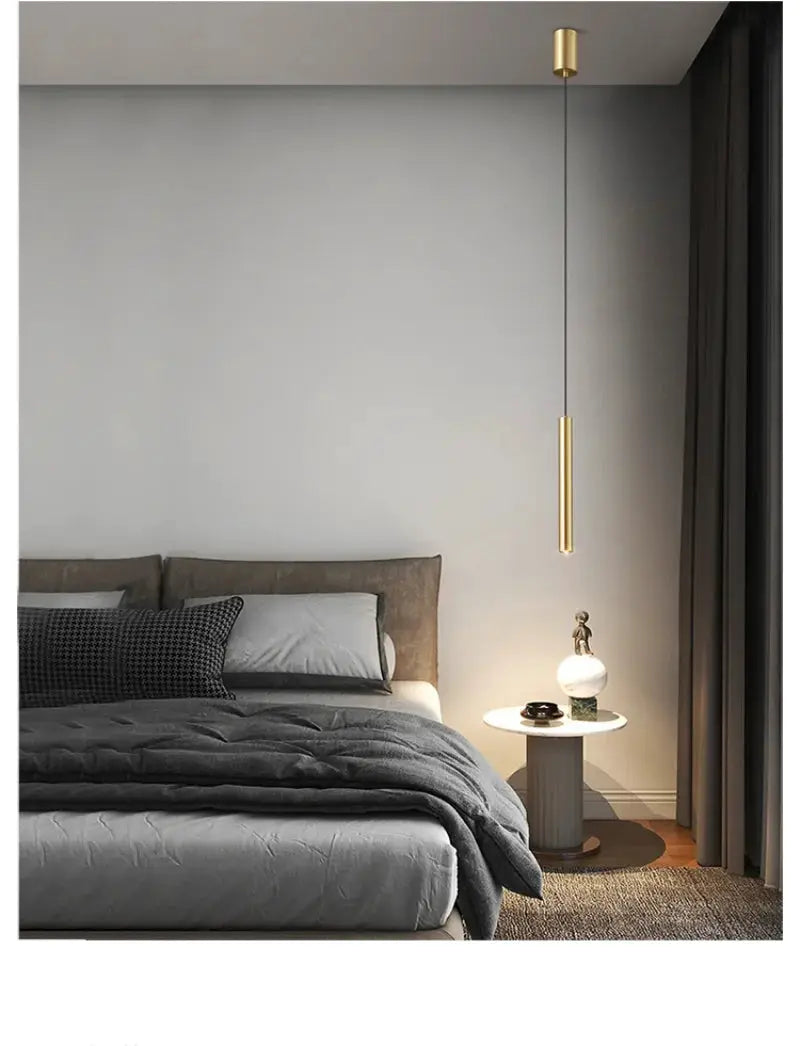 Minimalist bedside pendant lamp in gold finish, suspended above bed; 1 round table lamp on the nightstand.