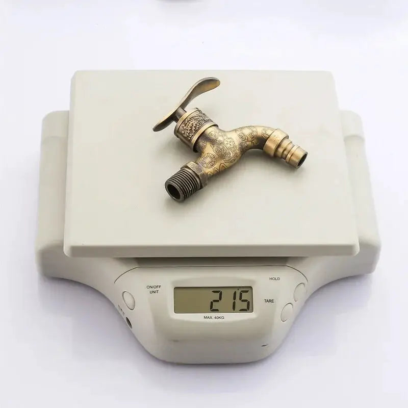 Antique-brass outdoor faucet with ornate carved zinc-alloy body