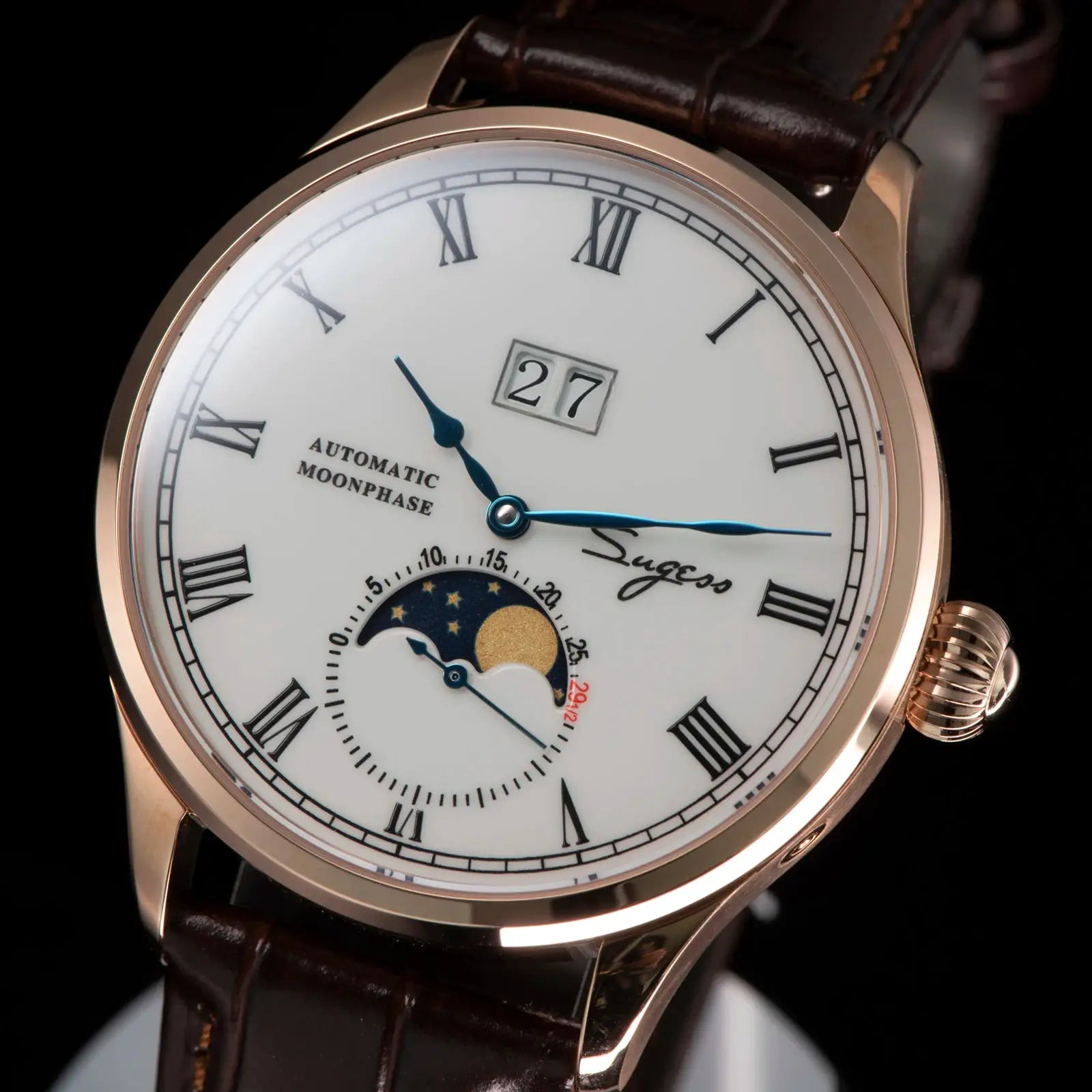 Sugess Tianjin ST25 automatic moonphase men's watch with rose-gold case, white dial, blue hands, leather strap.
