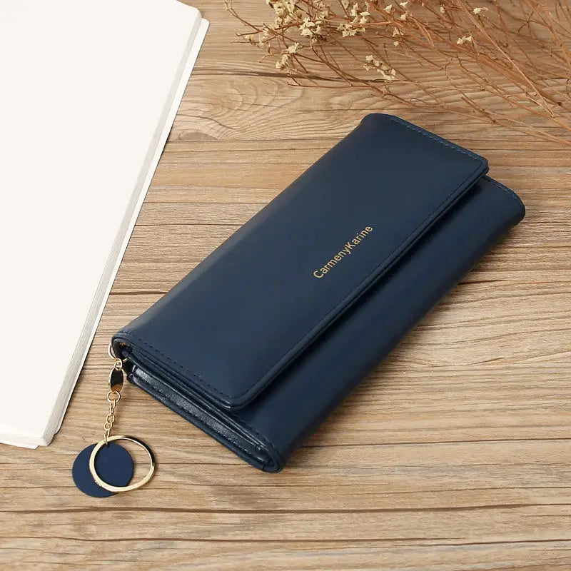 Navy blue PU leather long wallet for women with fold design, gold logo, and circular keyring charm