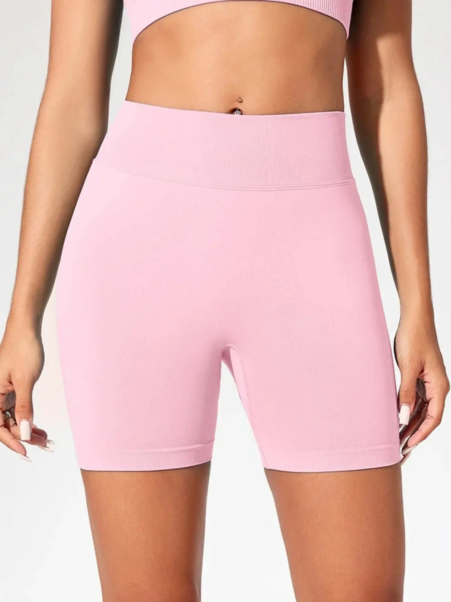 Women’s pink seamless high-waist gym shorts for fitness, yoga, running and training.