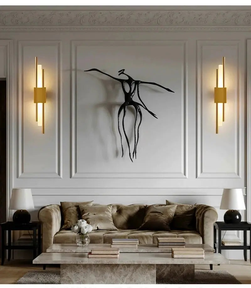 Nordic LED wall lamps, a pair, gold-tone sconces flanking a modern living room panel.