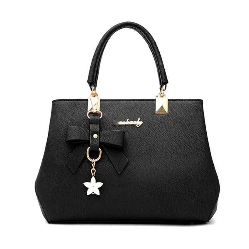 Simples Market elegant black bowknot shoulder bag with gold-tone hardware and star charm