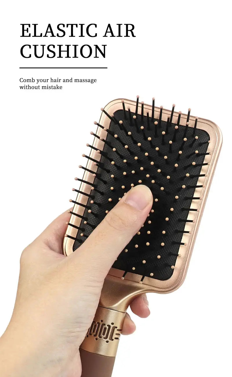 Hair detangler brush by Simples Market, rose-gold handle with black elastic air cushion and beige bristle tips.