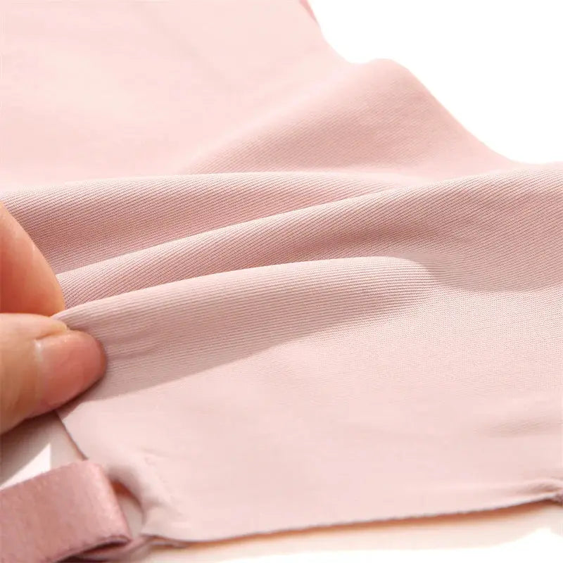 Women seamless bra fabric close-up in soft pink ice silk
