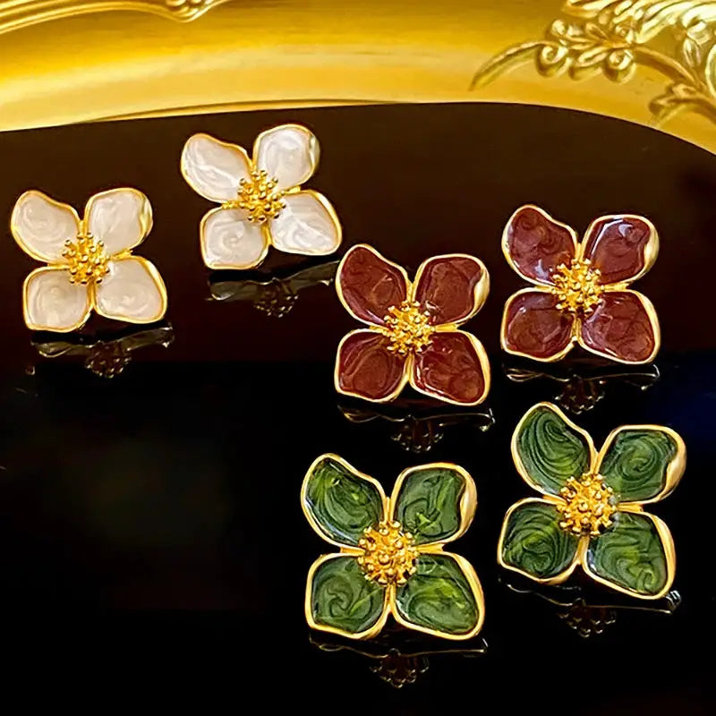 Simples Market enamel flower stud earrings set of 6 in white, pink, maroon, and green with gold edges and yellow centers