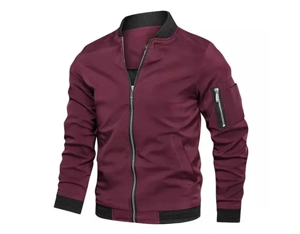 Simples Market burgundy men's windbreaker with zip front, black ribbed collar and cuffs, and sleeve zip pocket.