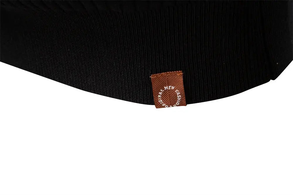 AIOPESON polo shirt with button placket; black ribbed knit with brown tag at hem.