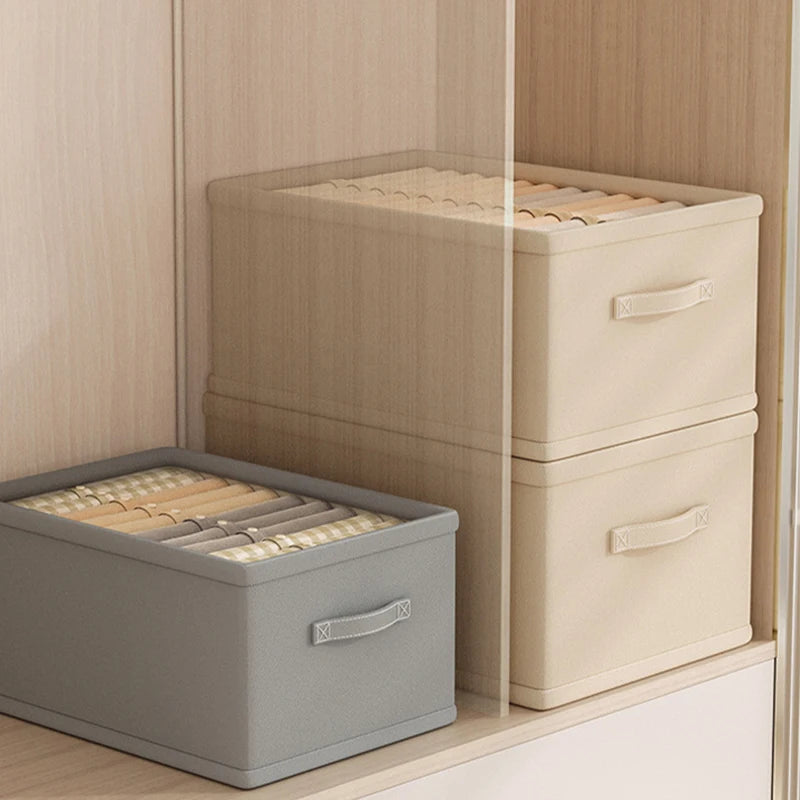 Fabric clothes organizer storage boxes set of two in gray and beige with handles, shown in a wardrobe