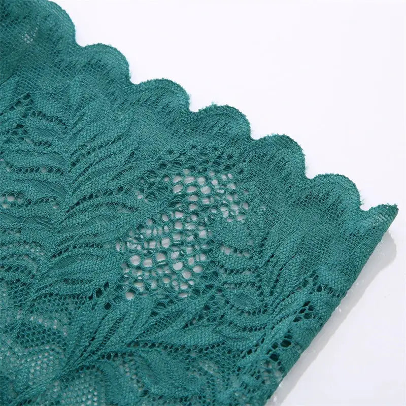Lace floral underwear in teal, close-up with scalloped edge