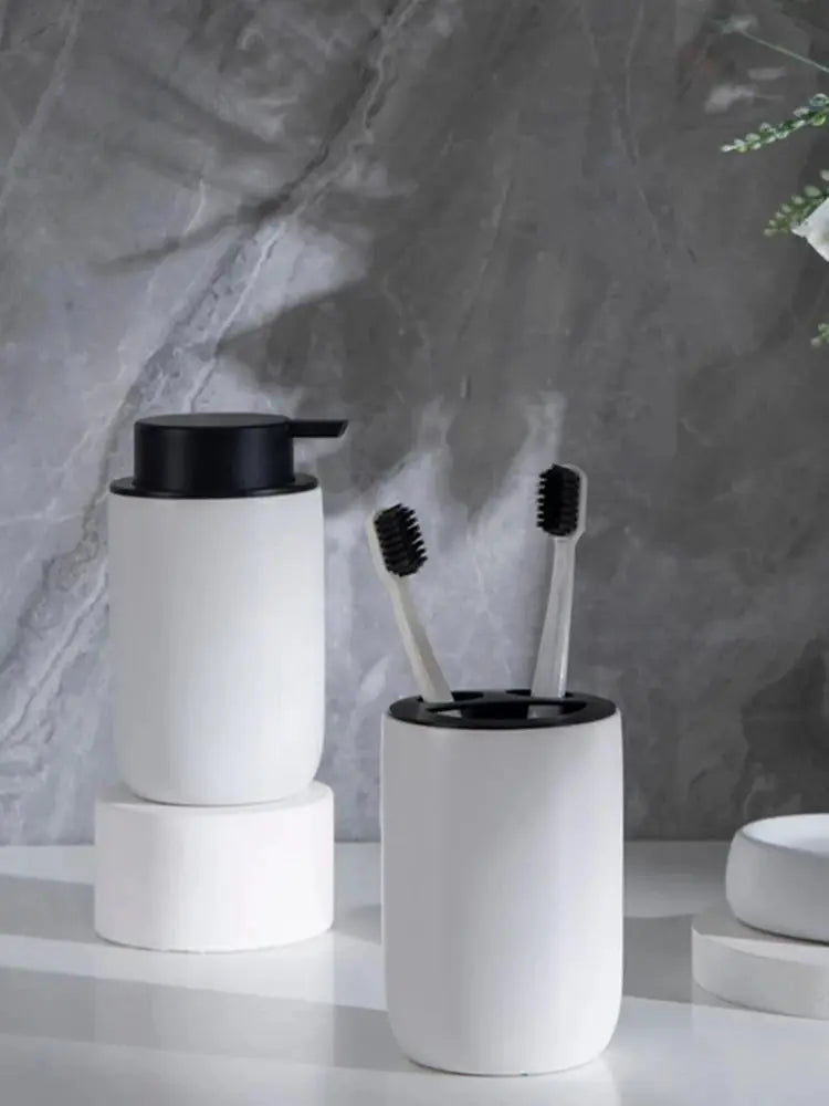 Bathroom set ceramic white with black lids; pump dispenser and toothbrush holder with two toothbrushes