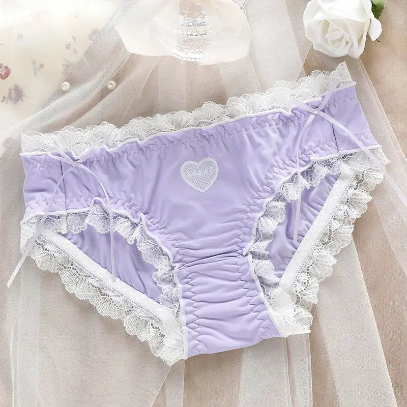 Lilac low-waist panties with white lace trim, heart appliqué, and bow-tied side ribbons