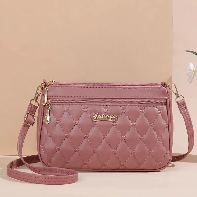 NovaLuxe PU Leather Messenger Bag For Women With Fur Ball Accent And Secure Zipper Closure