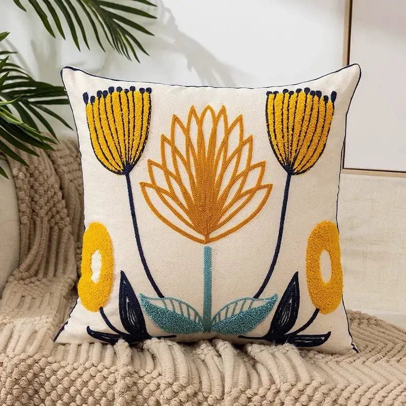 Boho floral embroidered cotton tufted throw pillow cover with yellow blossoms and teal leaves for couch, sofa, and bed