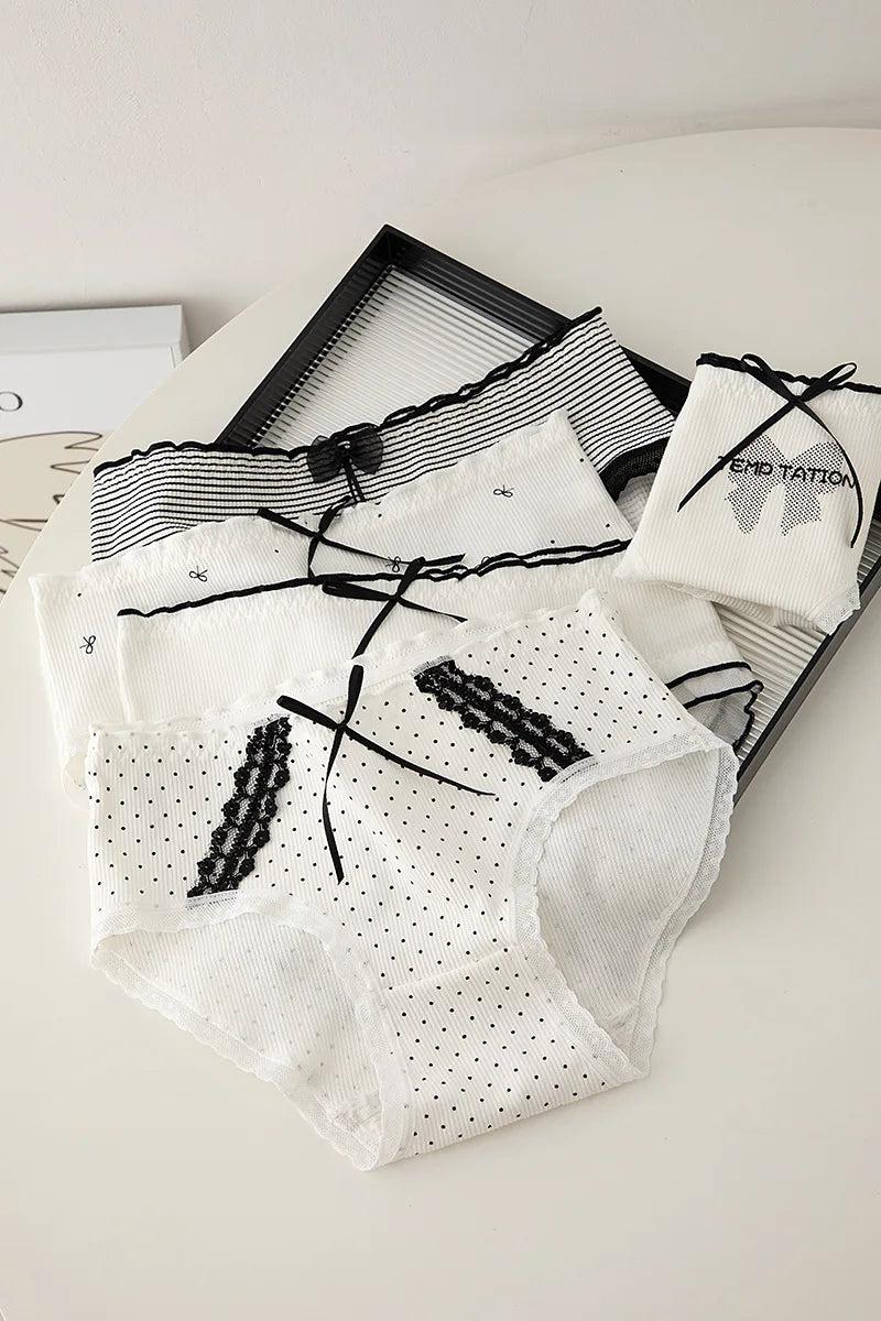 Simples Market women's lace panties set in white with black bow accents and polka dot pattern.
