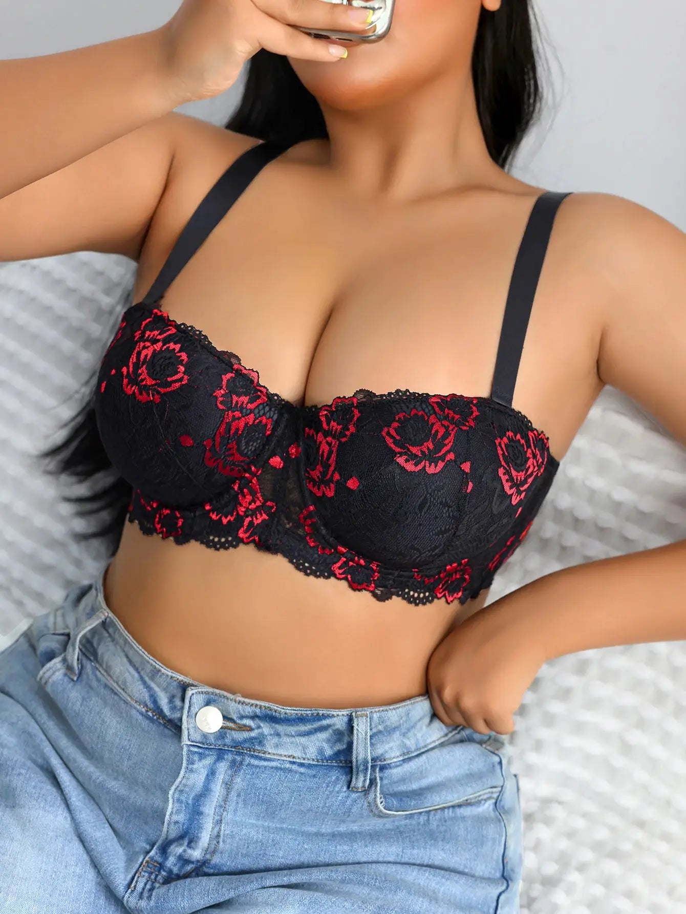 Plus-size black lace push-up bra with red floral embroidery and wide straps; underwire support