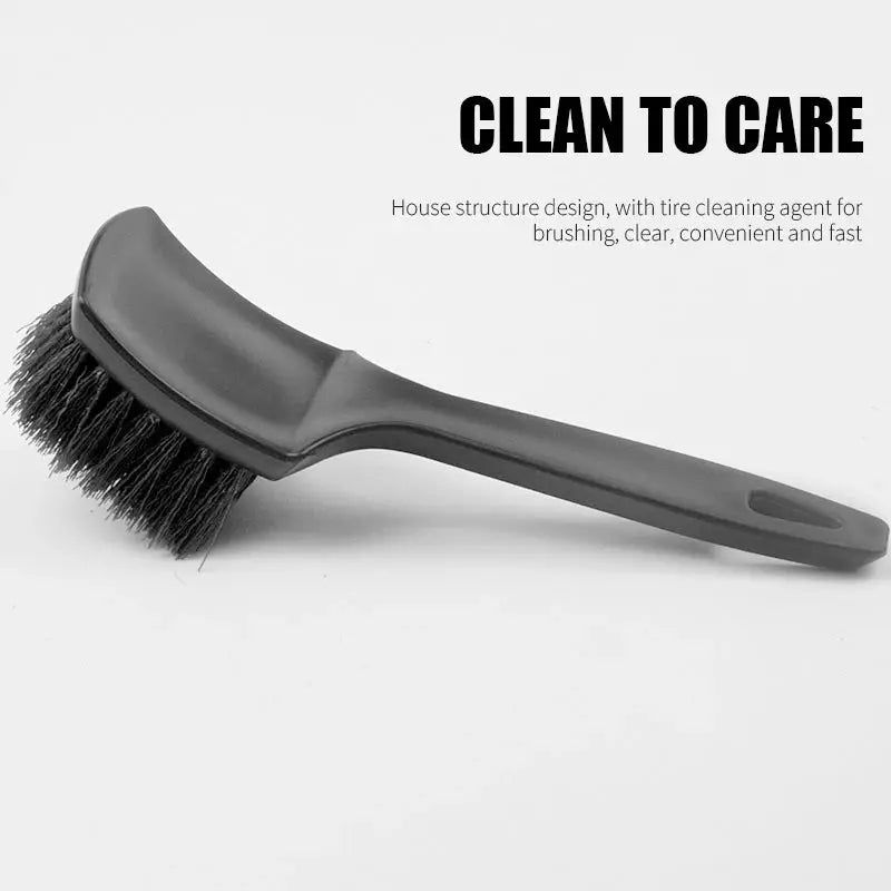 Car tire rim brush with black plastic handle and dense hard bristle head for wheel cleaning