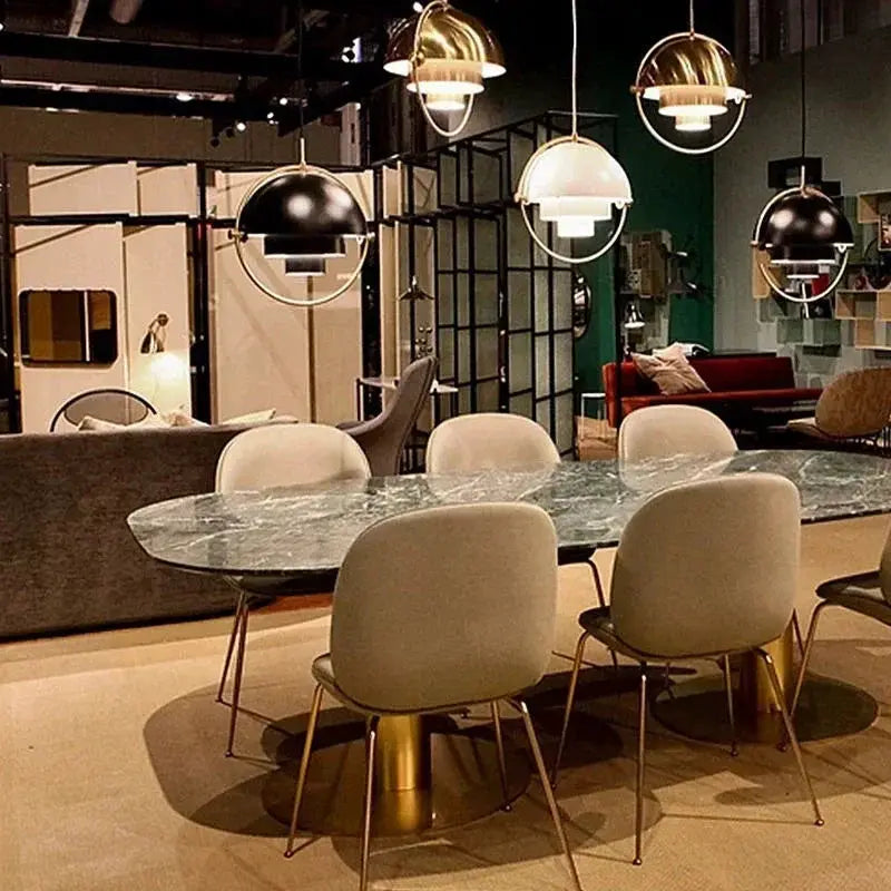 Pendant lights for kitchen island in iron with gold and chrome finishes; five round hanging LED fixtures