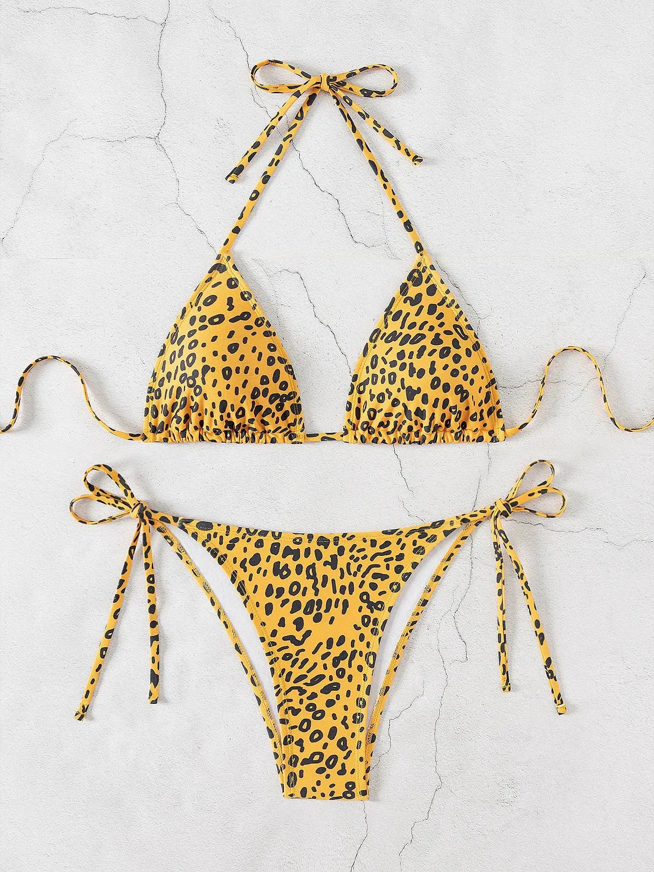Triangle bikini set with leopard print push-up top and Brazilian-cut bottoms by Simples Market
