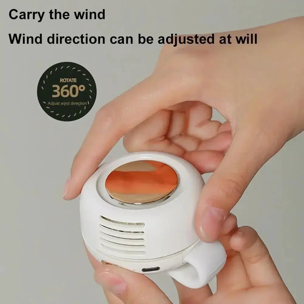 Portable clip-on bladeless fan; white body with orange top and 3 speed settings
