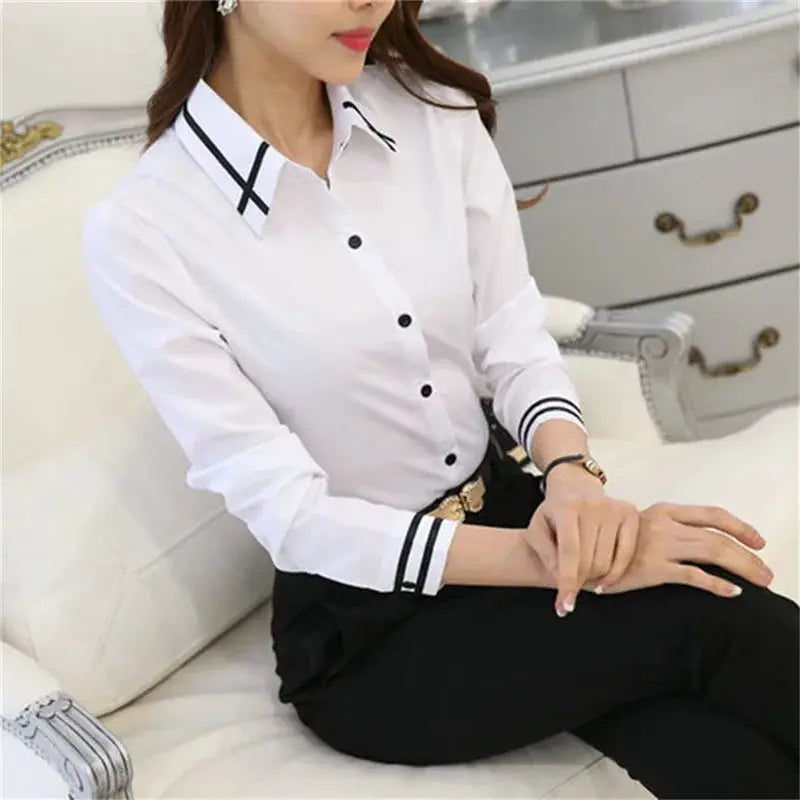 White long-sleeve women's shirt from Simples Market with black trim on collar and cuffs, office blouse style