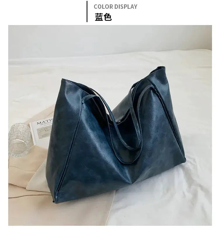 Blue PU leather women’s tote bag; large-capacity shoulder bucket style by Simples Market